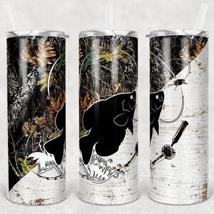 May include: Three stainless steel tumblers with a black and white camouflage pattern. The tumblers feature a silhouette of a fish with a fishing line and hook. The tumblers are perfect for keeping drinks cold or hot.