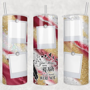 May include: A sublimation tumbler with a red, gold, and white marble design. The tumbler has three photo spaces and the text "Your wings were ready but our hearts were not".