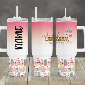 May include: A pink and white stainless steel tumbler with a handle and a straw. The tumbler has a design of a school library associate with a cactus, apple, and books. The tumbler is personalized with the name "NAME".