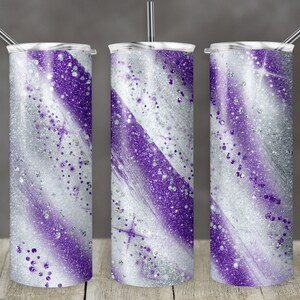 May include: Three stainless steel tumblers with a purple and silver glitter design. The tumblers have a brushed metal finish and are perfect for keeping drinks cold or hot.