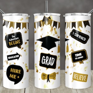 May include: Three white tumblers with black and gold graduation themed designs. The designs include a graduation cap, confetti, and phrases like "The Adventure Begins", "Grad", "I Survived", "Time to Adult", "Educated", "Hire Me", "Believe", and "Class of 2022".