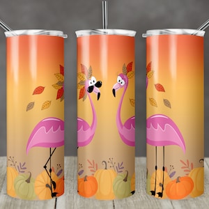 May include: Three stainless steel tumblers with a fall-themed design featuring pink flamingos with autumn leaves on their heads and pumpkins at the bottom.