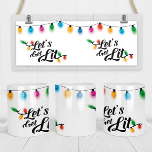 May include: Three white mugs with a string of colorful Christmas lights and the text "Let's get Lit" printed on them.