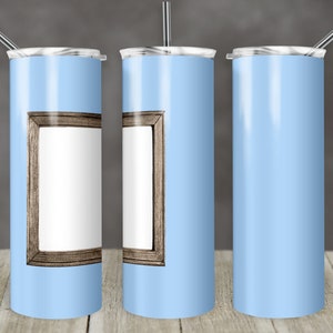 May include: Three stainless steel tumblers with a light blue finish. The tumbler on the left has a wood-framed picture frame design. The tumbler in the middle has a wood-framed picture frame design. The tumbler on the right is plain.