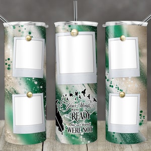 May include: Three stainless steel tumblers with a green and gold design. The tumblers have a white background with a green and gold watercolor design. The tumblers have three photo frames with white borders. The tumblers have the text "Your wings were ready but our hearts were not" printed on the middle tumbler.