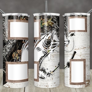 May include: A set of three stainless steel insulated tumblers with lids and straws. The tumblers feature a fishing theme with a white bass graphic, camouflage, and a distressed wood background. Each tumbler has two rectangular frames.