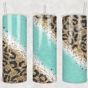 May include: Three stainless steel tumblers with lids and straws. The tumblers are decorated with a teal and gold glitter pattern with a black leopard print.