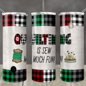 May include: Three stainless steel tumblers with a quilting theme. The tumblers are decorated with red, green, and black plaid patterns, buttons, and sewing-themed images. The text on the tumblers reads "QUILTING IS SEW MUCH FUN!"