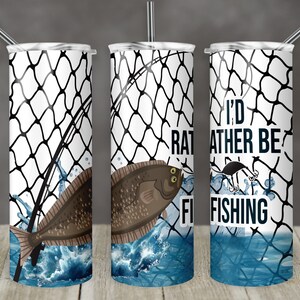 May include: Three stainless steel tumblers with a fishing net design. The tumblers have a white background with a black fishing net design. The middle tumbler has a brown fish and the text "I'd Rather Be Fishing".