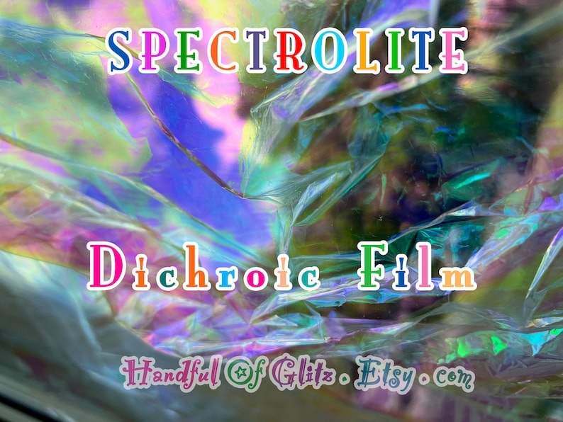 Crinkled foil sheet catching bold rainbow reflections, used in ASMR videos for visual and sound effects.