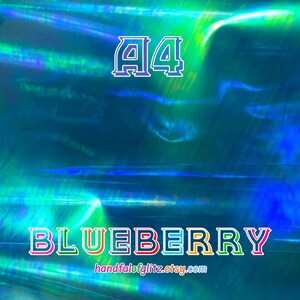 Flashy blue mylar with spectacular green and yellow reflections. Iridescent color shifting film for resin crafts and more. Blueberry dichroic film showing color-shifting light under angle.