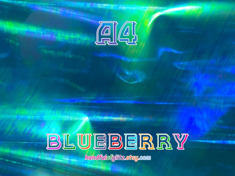 Flashy blue mylar with spectacular green and yellow reflections. Iridescent color shifting film for resin crafts and more. Blueberry dichroic film showing color-shifting light under angle.