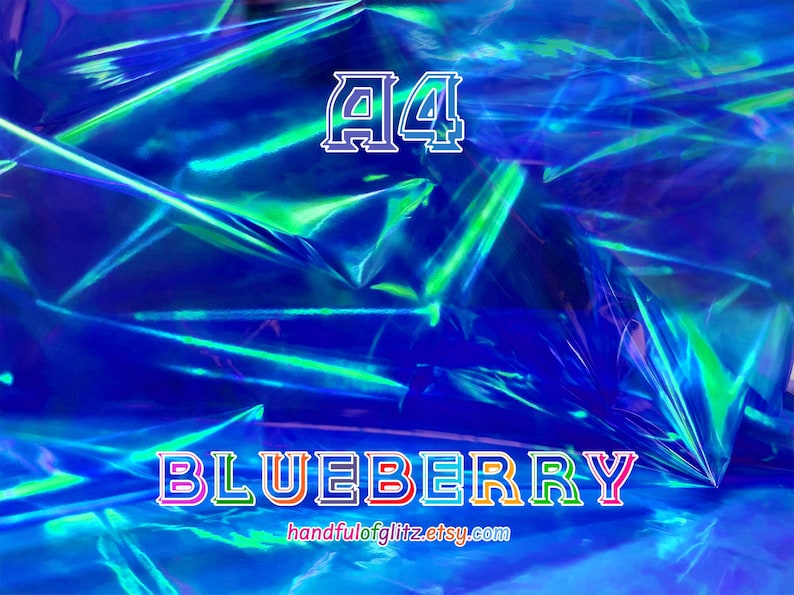Close-up of Blueberry dichroic foil, glowing with cool indigo and violet shimmer. Crinkled Blueberry foil sheet with vivid flashes, often used in ASMR videos.