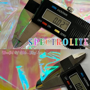 Close-up of Spectrolite-inspired foil, blazing with vivid rainbow flashes of blue, green, gold, and red.