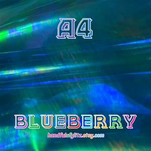 Flashy blue mylar with spectacular green and yellow reflections. Iridescent color shifting film for resin crafts and more. Blueberry dichroic film showing color-shifting light under angle.