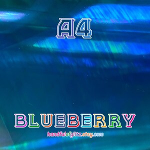 Flashy blue mylar with spectacular green and yellow reflections. Iridescent color shifting film for resin crafts and more. Blueberry dichroic film showing color-shifting light under angle.