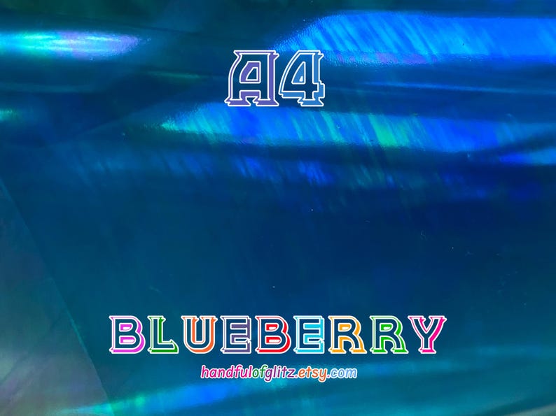 Flashy blue mylar with spectacular green and yellow reflections. Iridescent color shifting film for resin crafts and more. Blueberry dichroic film showing color-shifting light under angle.