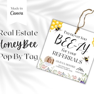 Può includere: Un'etichetta bianca a tema ape con il testo "I'm never too BEE-ZY for your REFERRALS". L'etichetta include anche il nome "OLIVIA MOORE" e il testo "Real Estate Agent COMPANY NAME HERE LOGO HERE".