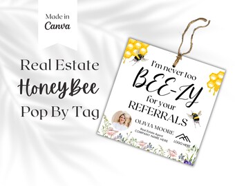 May include: A white tag with a bee theme and the text "I'm never too BEE-ZY for your REFERRALS". The tag also includes the name "OLIVIA MOORE" and the text "Real Estate Agent COMPANY NAME HERE LOGO HERE".