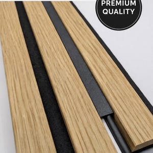 May include: Cable tidy system with light brown wooden panels and black felt. The product features the text "HIDE UNSIGHTLY CABLES" and a "PREMIUM QUALITY" badge. The system is designed to conceal cables and wires.