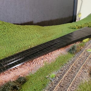 Extended re-railer