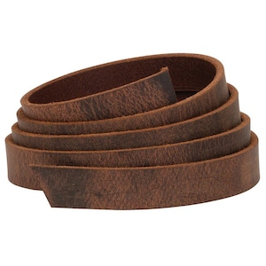 May include: A roll of brown leather straps, perfect for crafting projects. The leather has a distressed look and feel.