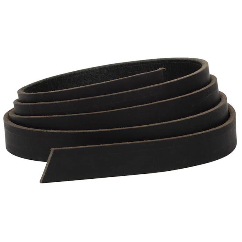 May include: A roll of black leather strap, approximately 1 inch wide, coiled up on a white background.
