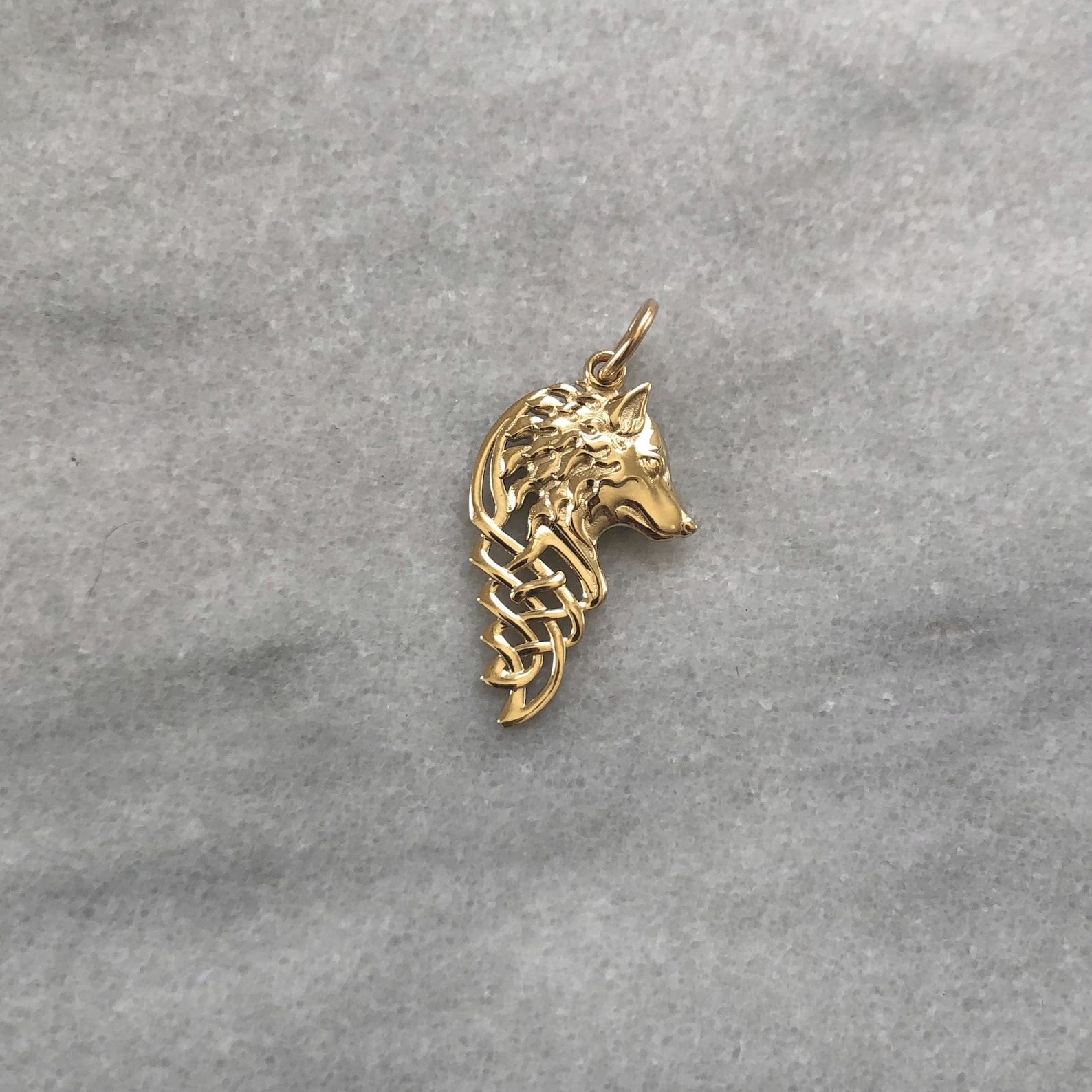 solid gold wolf pendant