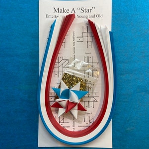 Make a Star Kit - 100 Strips - Red, White and Blue. Includes sample star, instructions and glitter pack. Makes 25 stars.