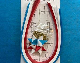 Make a Star Kit - 100 Strips - Red, White and Blue. Includes sample star, instructions and glitter pack. Makes 25 stars.