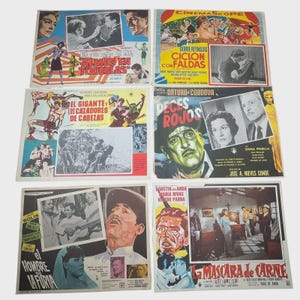 May include: A collection of vintage movie posters, featuring colorful illustrations and text. The posters showcase various film titles, actors, and scenes, with a focus on Spanish-language cinema. The posters are arranged on a light-colored surface.