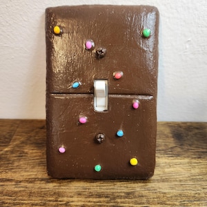 Cosmic Brownie light switch cover
