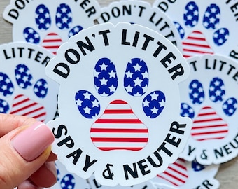 May include: A white sticker with a paw print in red, white, and blue with stars. The text on the sticker reads "Don't Litter, Spay & Neuter".