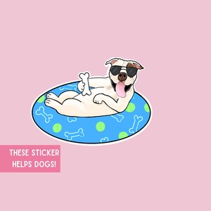 May include: A sticker depicting a cartoon dog in sunglasses, relaxing on a blue pool float decorated with bones and tennis balls. The dog holds a bone and has its tongue out. Text on a pink background reads: "THESE STICKER HELPS DOGS!"