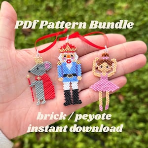 May include: A hand holding three beaded ornaments: a gray mouse with a red cape, a blue and white nutcracker, and a pink ballerina. Each ornament is attached to a red ribbon. Text on the image reads "PDF Pattern Bundle" and "brick / peyote instant download."