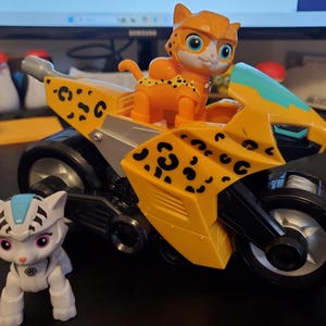 May include: A set of three ceramic vases in varying heights. The vases are white with a textured, ribbed design. The tallest vase is approximately 10 inches tall, the medium vase is 8 inches, and the smallest is 6 inches.