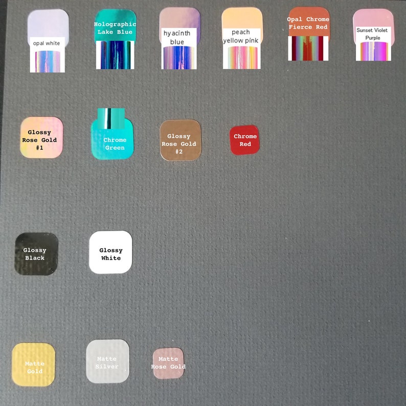 May include: A chart of nail polish colours with names like "Holographic Lake Blue", "Opal Chrome Fierce Red", and "Glossy Rose Gold #1".
