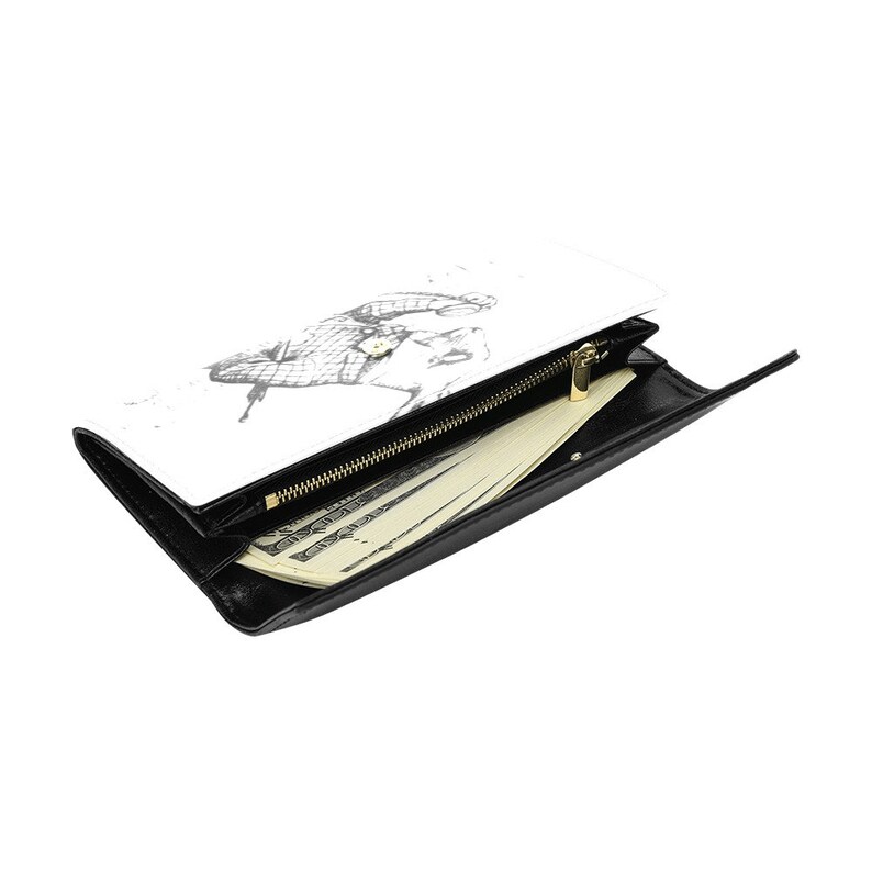 Puede incluir: Una cartera de cuero negro con una cremallera blanca y un dise&ntilde;o blanco en la parte delantera. La cartera est&aacute; abierta y hay billetes dentro.