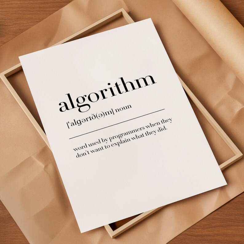 May include: A white framed print with the word "algorithm" in black text. The definition of the word is written below in black text: "['algərı&eth;(ə)m] noun word used by programmers when they don't want to explain what they did."