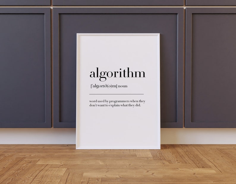 May include: A white framed print with a black and white definition of the word "algorithm". The definition reads: "['algərı (ə)m] noun word used by programmers when they don't want to explain what they did."