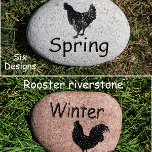 May include: Two painted river stones with chicken and rooster silhouettes. The top stone is white with a black chicken silhouette and the text "Spring". The bottom stone is red with a black rooster silhouette and the text "Winter".