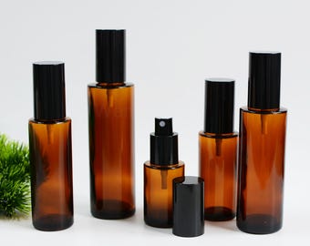 Frascos de vidrio ámbar cilíndricos con atomizador de niebla fina para aceites esenciales (1-200 unidades, 20 ml, 30 ml, 50 ml, 60 ml, 80 ml, 100 ml), con protección UV. Venta al por mayor.
