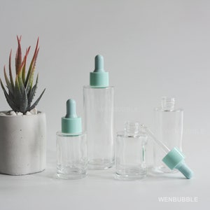 1-200 pièces 20 ml 30 ml 50 ml 60 ml 80 ml 100 ml Flacons compte-gouttes d'huiles essentielles en verre transparent, jolie bouteille d'huile de sérum de soin de la peau bleu clair, vente en gros
