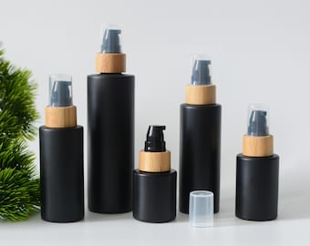 1-200 piezas 20 ml 30 ml 60 ml 120 ml 4 oz botella de bomba de suero de loción de vidrio negro mate, botella de aceite esencial negra de madera de bambú natural, venta al por mayor