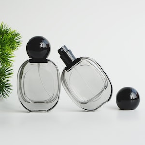 1-200 unidades de 1 oz (30 ml) de vidrio negro transparente con atomizador para perfume, botella de spray para aromaterapia de lujo, venta al por mayor