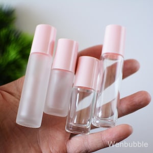 50-200 botellas de vidrio rosa transparente mate de 5 ml y 10 ml para aceites esenciales, botellas de perfume con rodillo, envases con rodillo para el cuidado de los labios, venta al por mayor
