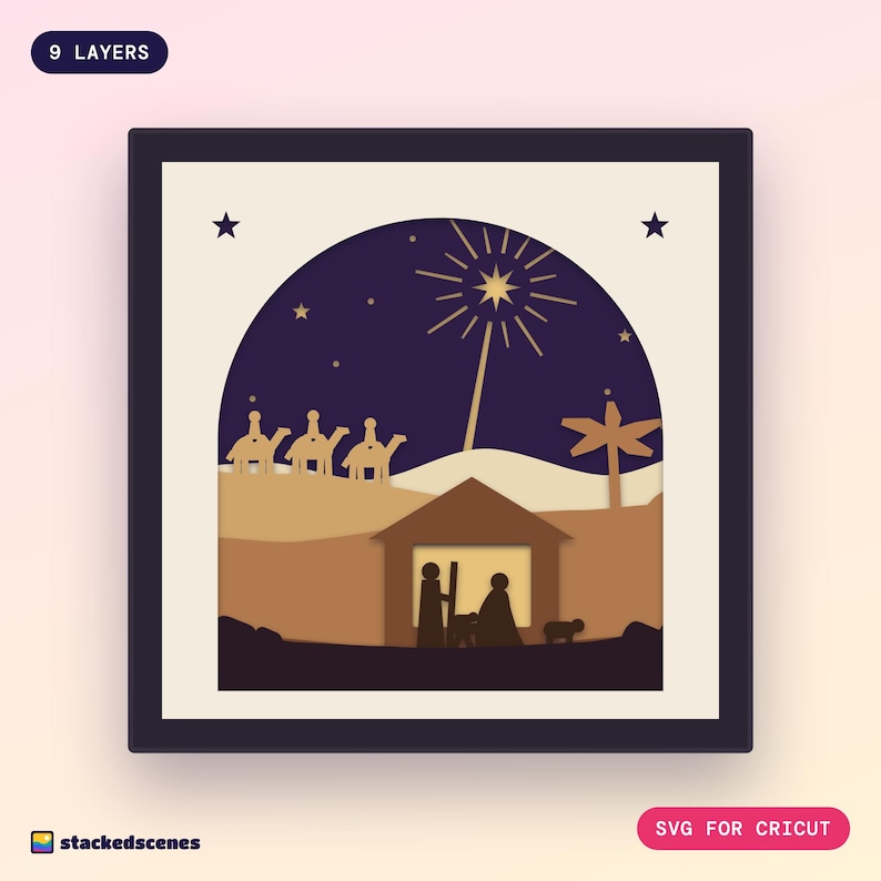 Finished 9-layer O Holy Night paper shadow box: a radiant star over a glowing stable with Mary, Joseph and the manger, camels on the ridge, in an ivory arch frame.