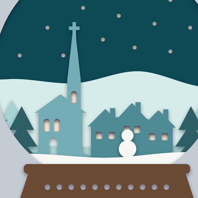 Close-up of the church, cottages with glowing windows and the snowman above the snow globe's wooden base and plaque.