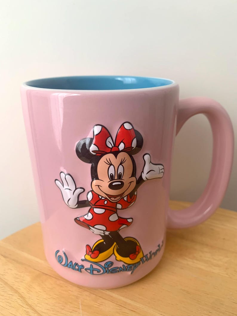 May include: A set of three ceramic mugs with a speckled, matte finish in cream, light grey, and dark grey. Each mug has a simple, minimalist design and a rounded handle.