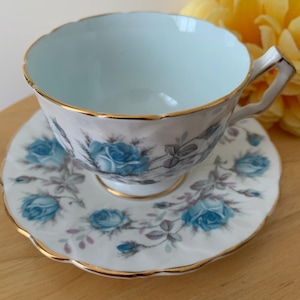 Aynsley Bleu Roses Bone China Light Blue Interior Color Footed Teacup and Saucer England
